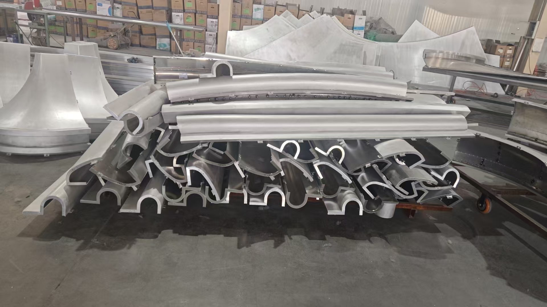 Fabrication photo of batch roll-curved aluminum profiles