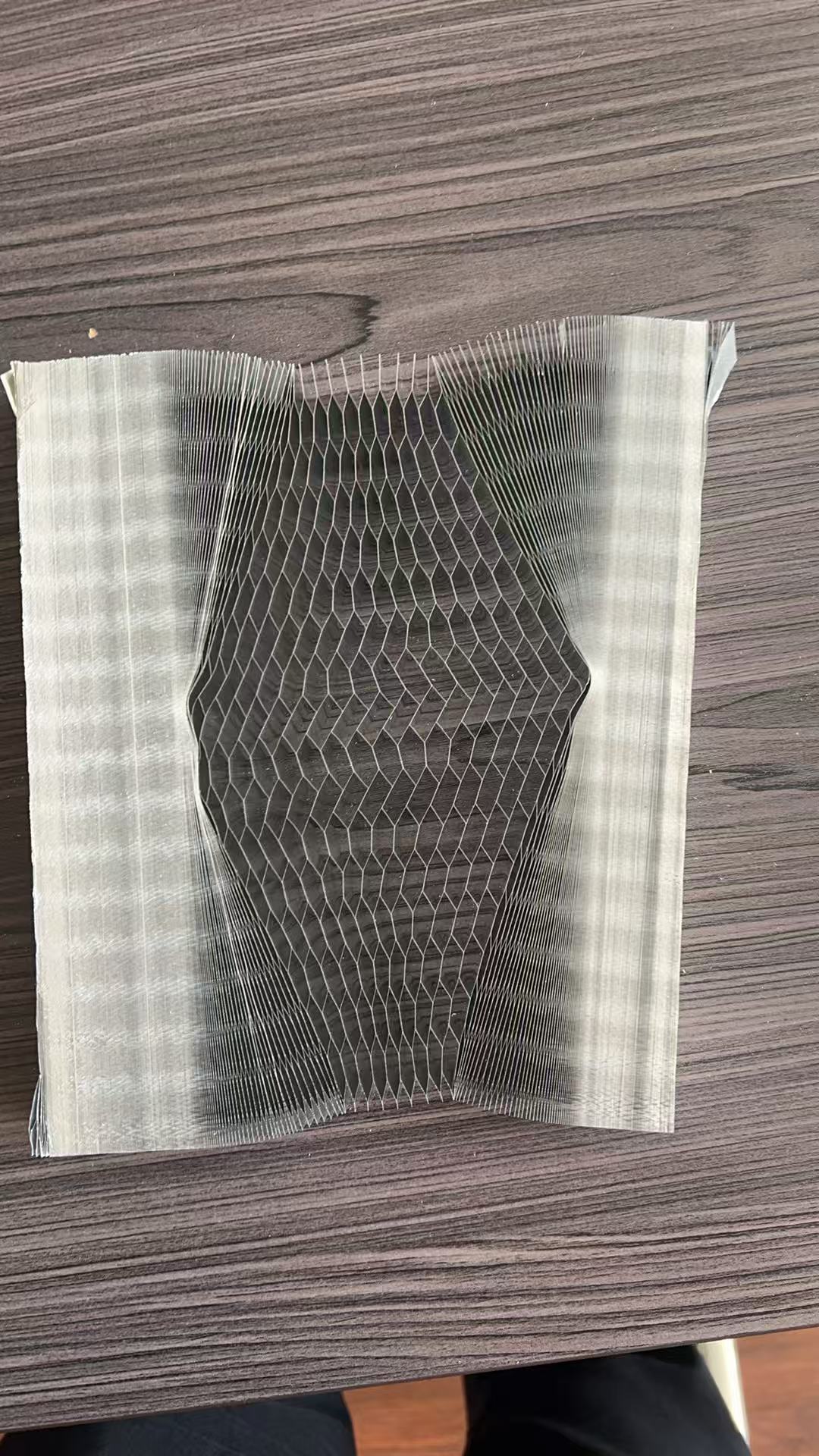 Curved expanded sample of aluminum honeycomb core