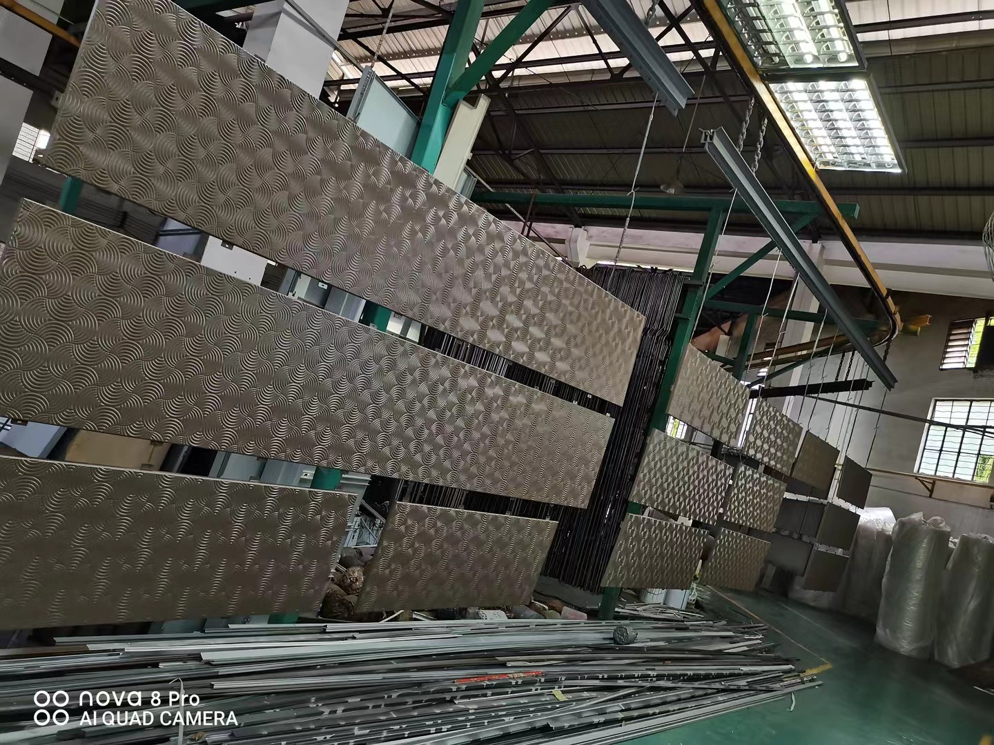 Batch surface treatment of metal panels with a repeating pattern