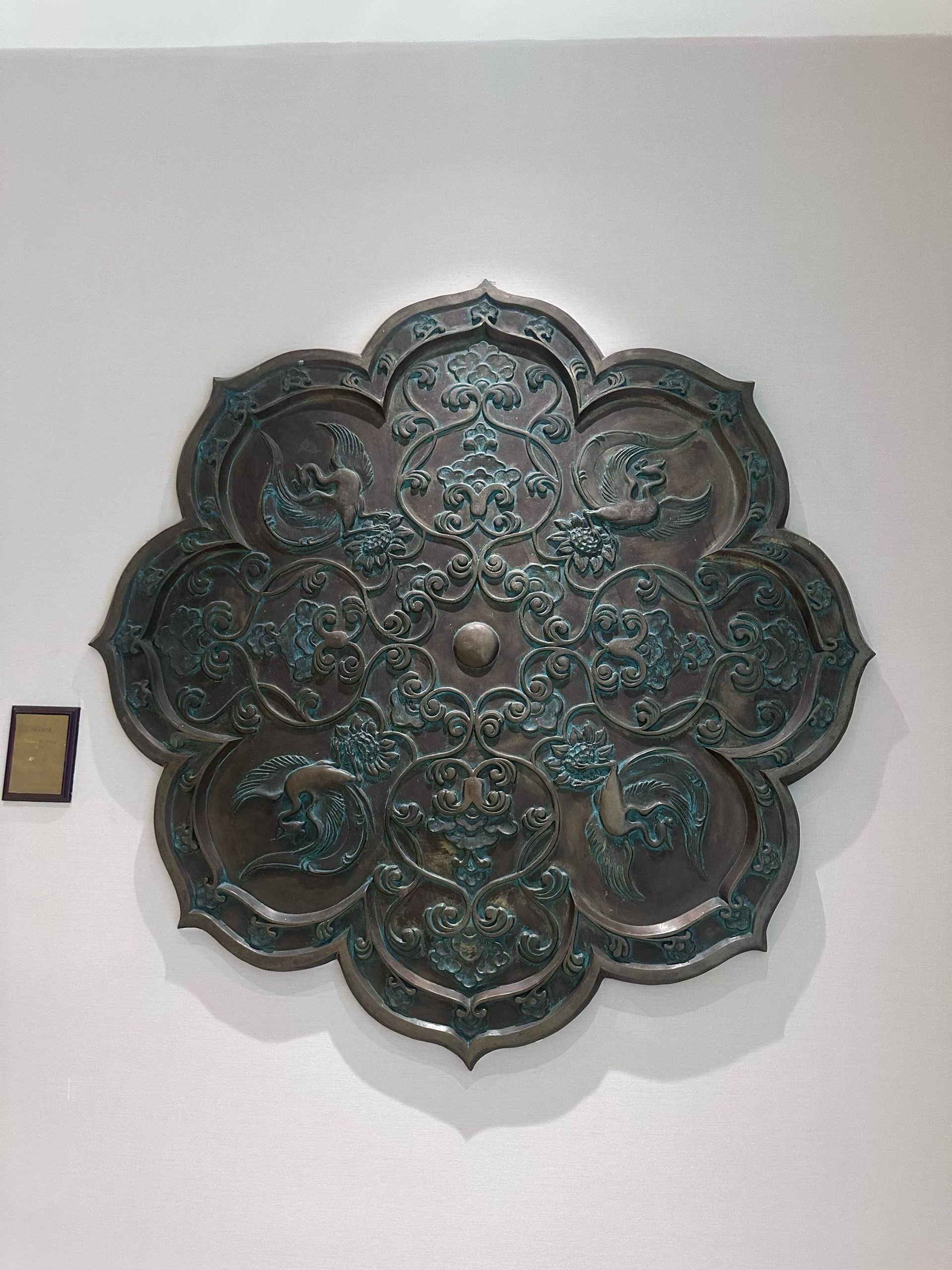 Physical large circular metal relief with a traditional pattern